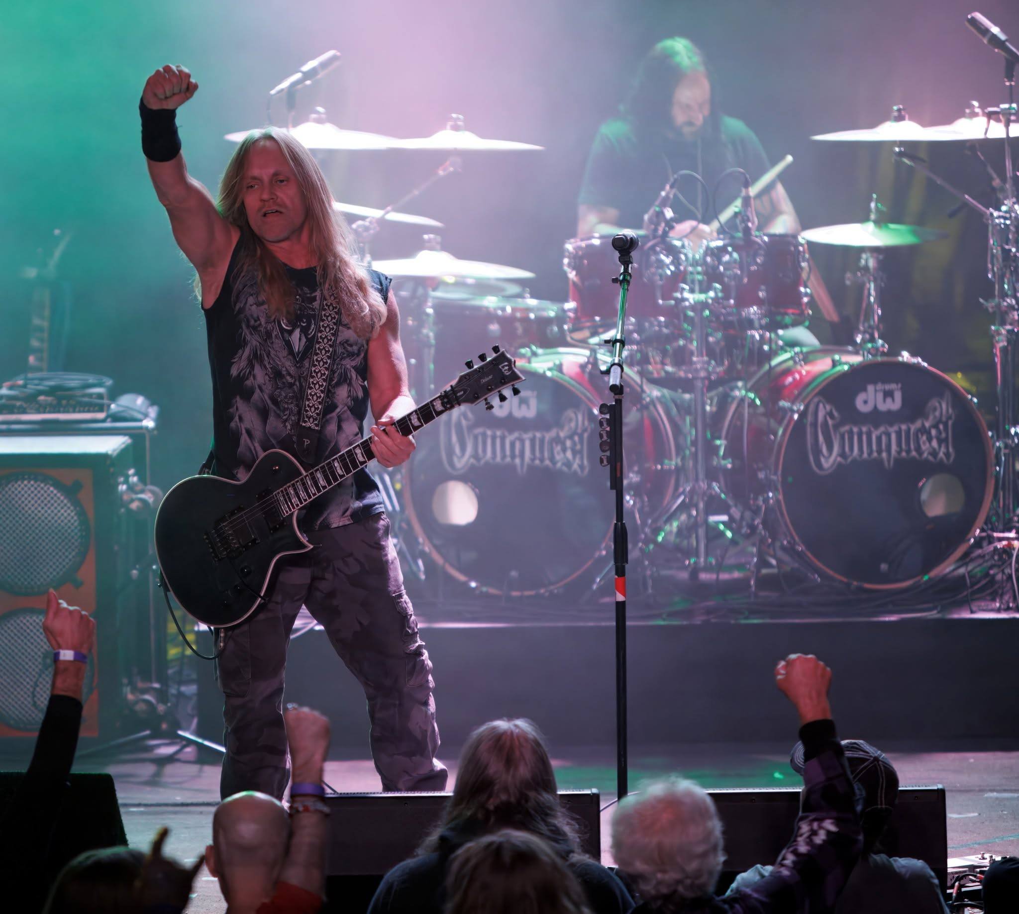 Derrick of Conquest on stage close up photo